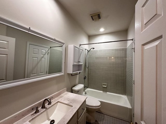 bathroom with shower / bathing tub combination, vanity, and toilet