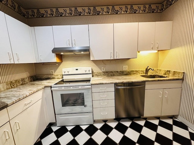 kitchen featuring under cabinet range hood, a sink, stainless steel dishwasher, tile patterned floors, and white range with electric cooktop