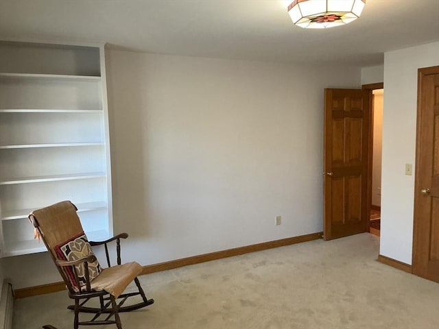 unfurnished room featuring baseboards and light carpet