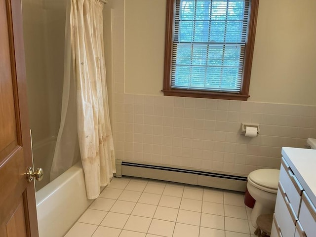 full bathroom with tile patterned flooring, a baseboard radiator, vanity, and tile walls