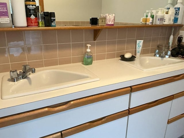 room details featuring a sink and backsplash