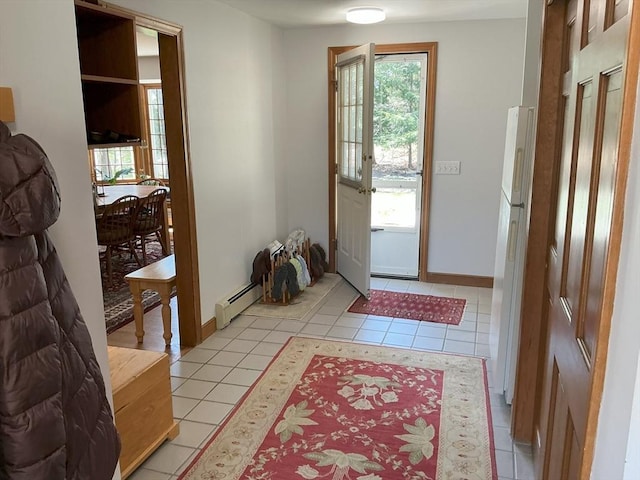 doorway featuring baseboards, light tile patterned floors, and a baseboard radiator