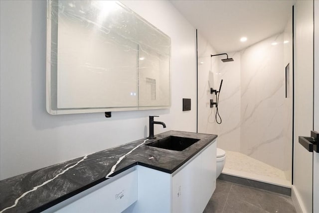 29 Woodford St Unit 2, Boston, MA 02125 - full bath featuring vanity, toilet, a marble finish shower, and tile patterned flooring