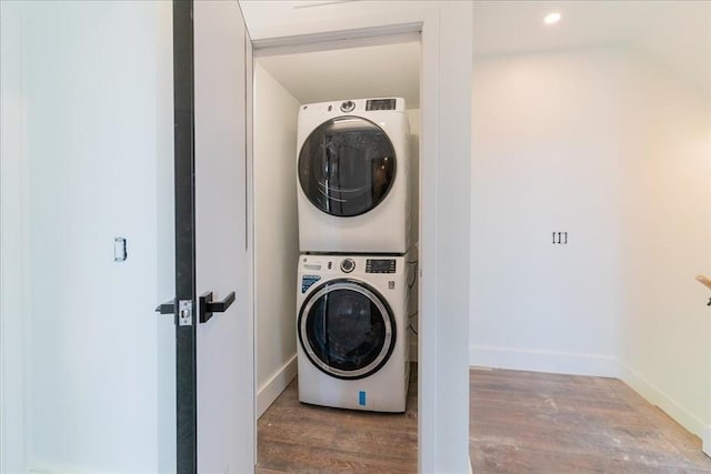 29 Woodford St Unit 2, Boston, MA 02125 - laundry room featuring stacked washer and clothes dryer, wood finished floors, baseboards, and recessed lighting