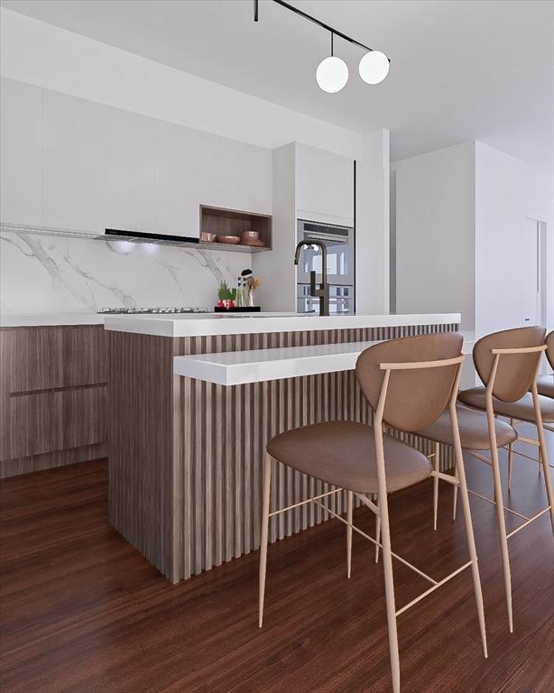 29 Woodford St Unit 2, Boston, MA 02125 - kitchen featuring wood finished floors, decorative backsplash, and modern cabinets