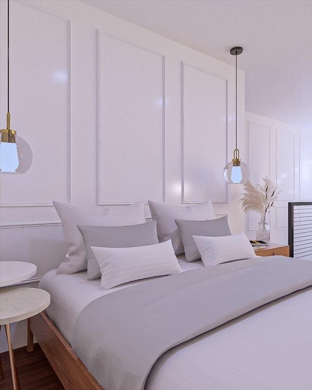 29 Woodford St Unit 2, Boston, MA 02125 - bedroom with a decorative wall and wood finished floors
