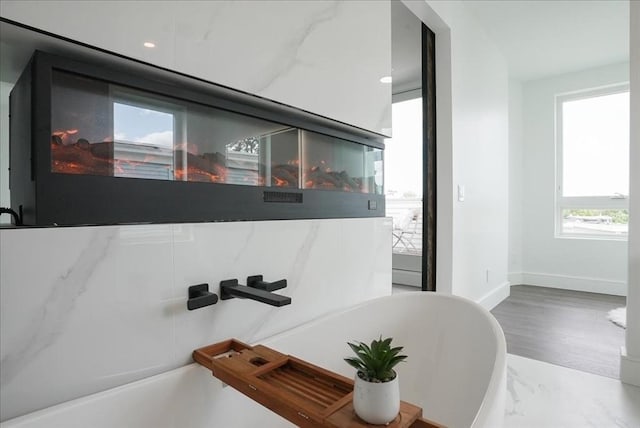 29 Woodford St Unit 2, Boston, MA 02125 - detailed view of baseboards, recessed lighting, and wood finished floors