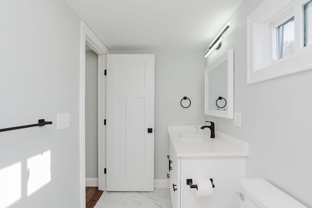 bathroom with vanity and toilet