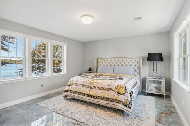 bedroom with visible vents and baseboards