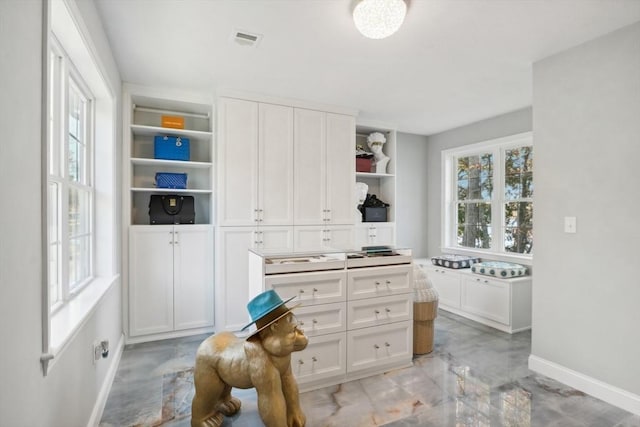 spacious closet featuring marble finish floor and visible vents