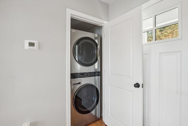 laundry area with stacked washing maching and dryer and laundry area