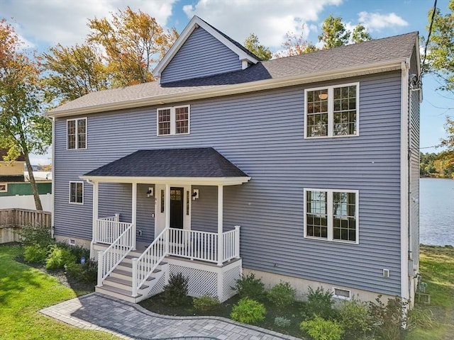 view of front of house featuring covered porch, roof with shingles, and crawl space