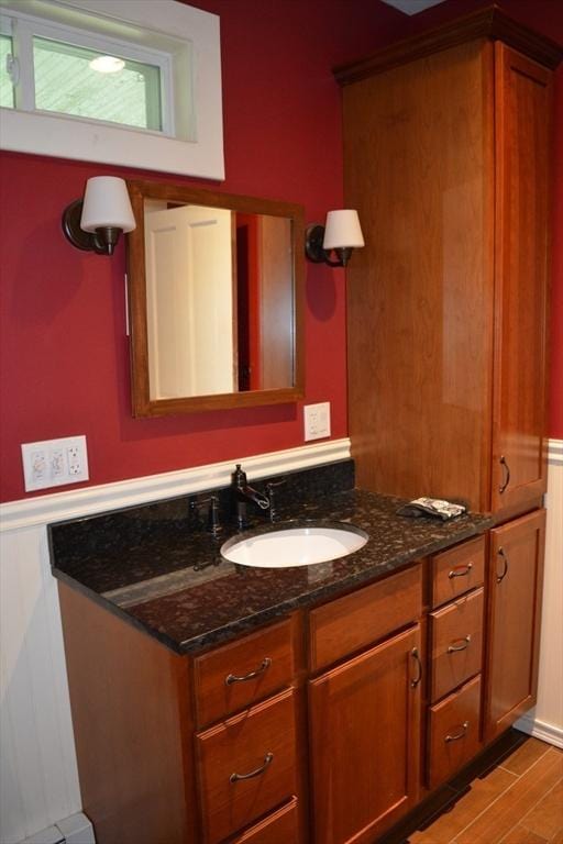19 Noble Ave, Westfield, MA 01085 - bathroom featuring vanity, wainscoting, and wood finished floors