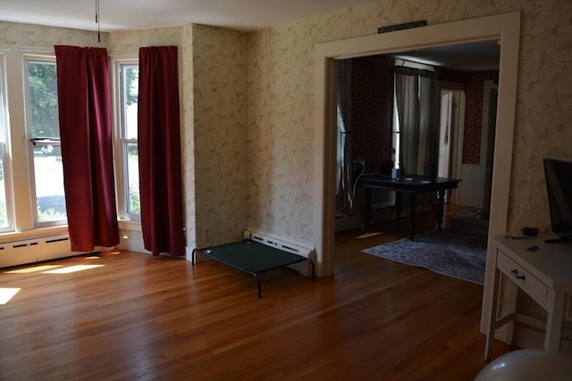 19 Noble Ave, Westfield, MA 01085 - spare room featuring wallpapered walls, wood finished floors, and a baseboard radiator