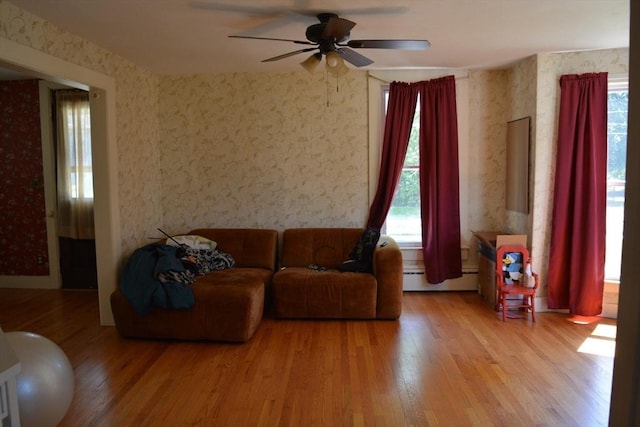 19 Noble Ave, Westfield, MA 01085 - living area with wallpapered walls, plenty of natural light, a ceiling fan, and wood finished floors