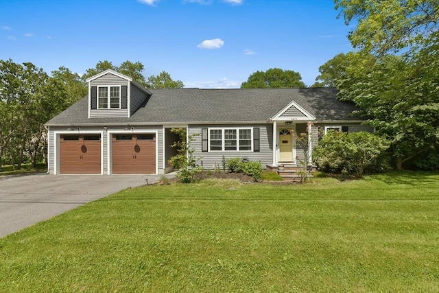 1026 Chandler St, Tewksbury, MA 01876 - view of front of property featuring asphalt driveway, a front lawn, a shingled roof, and a garage