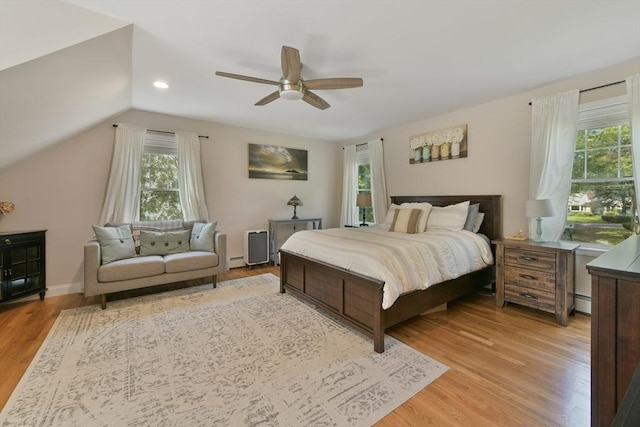 1026 Chandler St, Tewksbury, MA 01876 - bedroom featuring multiple windows, light wood-style floors, vaulted ceiling, a ceiling fan, and recessed lighting