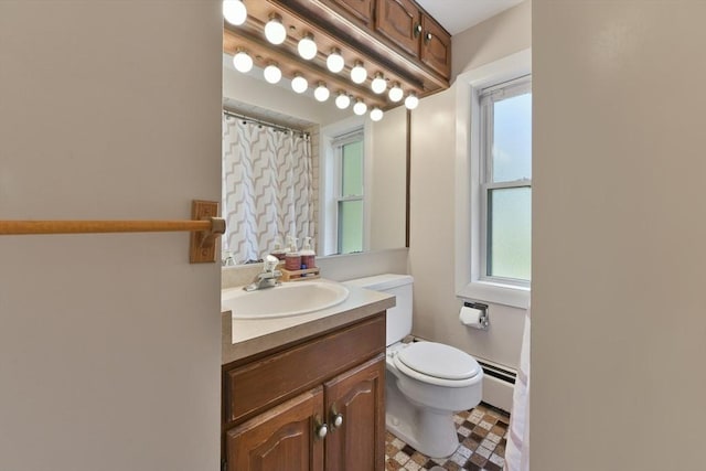 1026 Chandler St, Tewksbury, MA 01876 - bathroom with a baseboard heating unit, vanity, healthy amount of natural light, and a shower with shower curtain