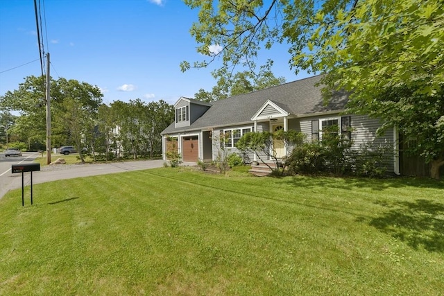 1026 Chandler St, Tewksbury, MA 01876 - cape cod house featuring concrete driveway, a front yard, and a garage