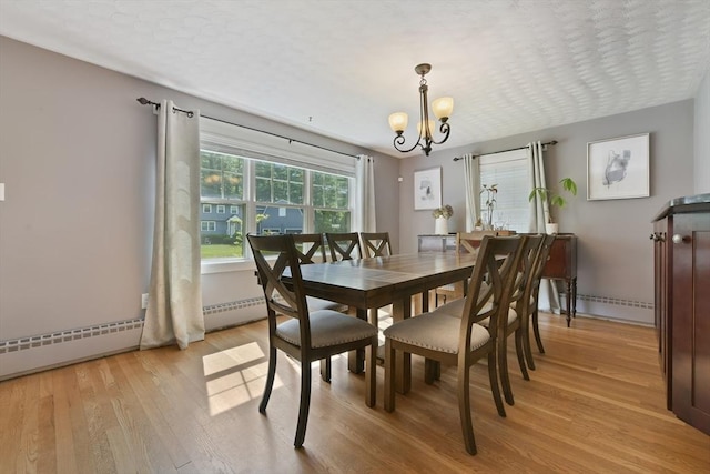 1026 Chandler St, Tewksbury, MA 01876 - dining room with light wood-type flooring and a chandelier