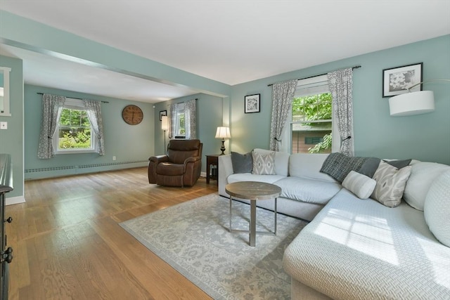 1026 Chandler St, Tewksbury, MA 01876 - living room featuring a baseboard radiator and wood finished floors