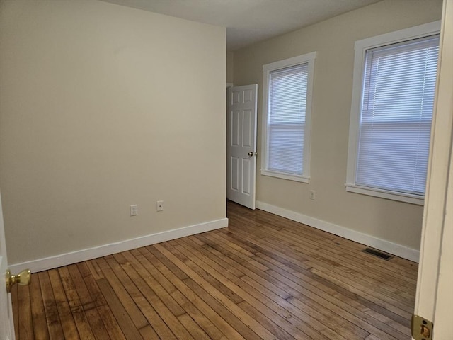 spare room featuring light wood-type flooring