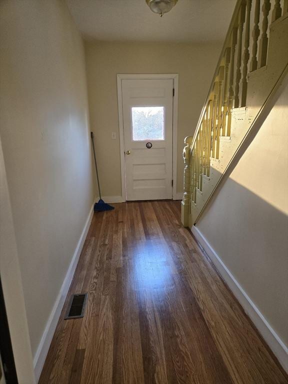 doorway to outside featuring dark hardwood / wood-style flooring