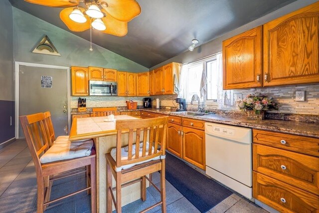 8 High St, Granby, MA 01033 - kitchen with stainless steel microwave, white dishwasher, a sink, lofted ceiling, and a ceiling fan