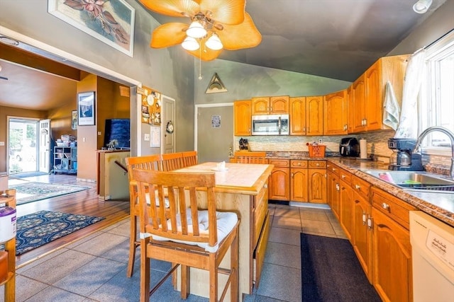 8 High St, Granby, MA 01033 - kitchen featuring stainless steel microwave, white dishwasher, ceiling fan, tile counters, and a sink