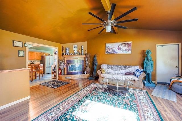 8 High St, Granby, MA 01033 - living area with wood finished floors, a ceiling fan, vaulted ceiling, and baseboards