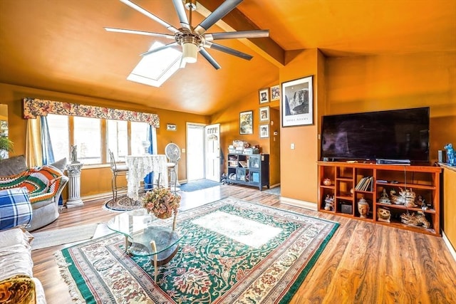 8 High St, Granby, MA 01033 - living area featuring a ceiling fan, wood finished floors, and a skylight