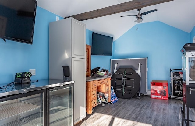 office featuring wine cooler, vaulted ceiling with beams, ceiling fan, and hardwood / wood-style flooring