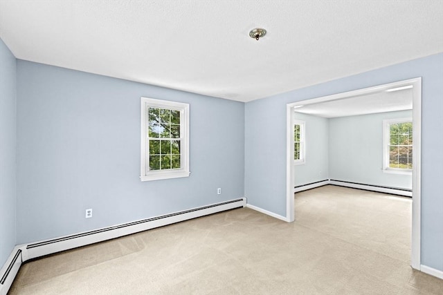 91 Observatory Waye, Marshfield, MA 02050 - empty room with a baseboard heating unit, carpet flooring, and plenty of natural light