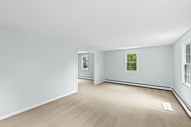 91 Observatory Waye, Marshfield, MA 02050 - empty room with light colored carpet, a baseboard radiator, a baseboard heating unit, and baseboards