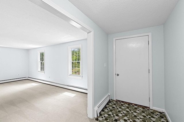 91 Observatory Waye, Marshfield, MA 02050 - entryway with baseboard heating, a textured ceiling, and baseboards