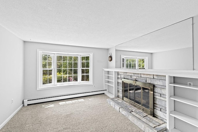 91 Observatory Waye, Marshfield, MA 02050 - unfurnished living room featuring baseboard heating, carpet, a stone fireplace, a textured ceiling, and baseboards