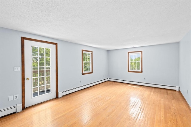 91 Observatory Waye, Marshfield, MA 02050 - spare room with a baseboard heating unit, baseboard heating, hardwood / wood-style flooring, healthy amount of natural light, and a textured ceiling