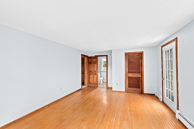 91 Observatory Waye, Marshfield, MA 02050 - unfurnished room with a baseboard heating unit, light wood-style floors, and baseboards