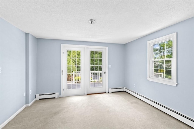 91 Observatory Waye, Marshfield, MA 02050 - spare room with a baseboard heating unit, carpet, healthy amount of natural light, and a textured ceiling