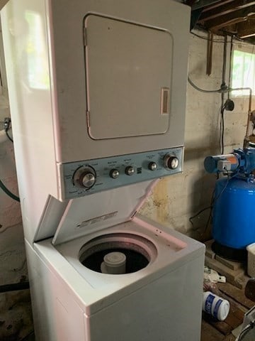 washroom with stacked washer and dryer