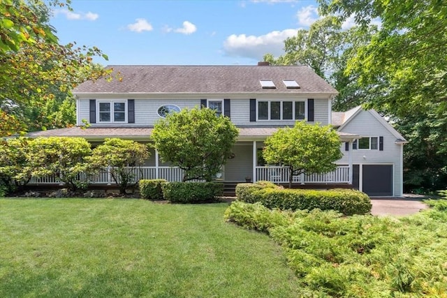 12 Whitcomb Ln, Hingham, MA 02043 - view of front of house featuring a front lawn, a garage, a porch, and driveway