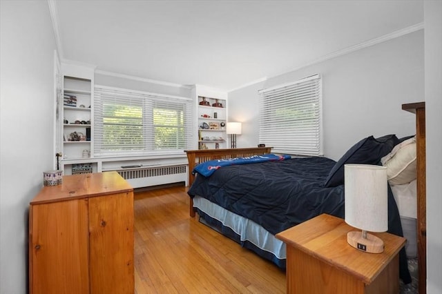 12 Whitcomb Ln, Hingham, MA 02043 - bedroom with radiator, crown molding, and wood finished floors