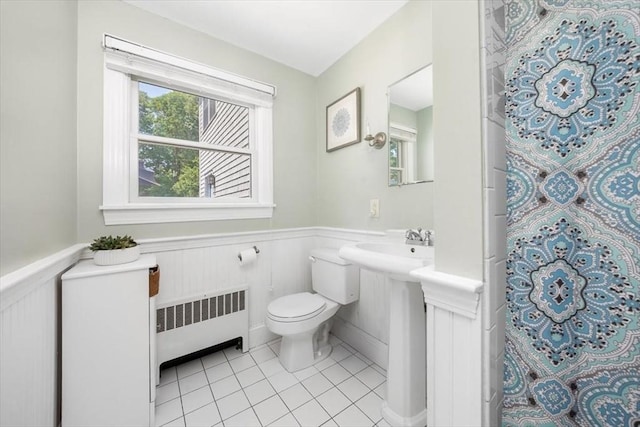 12 Whitcomb Ln, Hingham, MA 02043 - full bathroom featuring radiator heating unit, wainscoting, tile patterned floors, and a shower with shower curtain