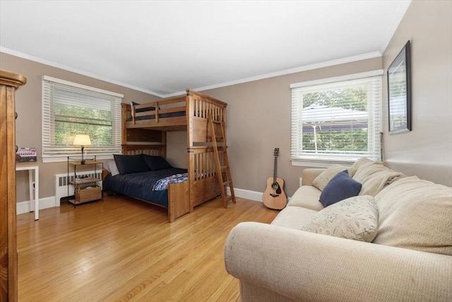 12 Whitcomb Ln, Hingham, MA 02043 - bedroom with radiator heating unit, crown molding, and light wood-style floors