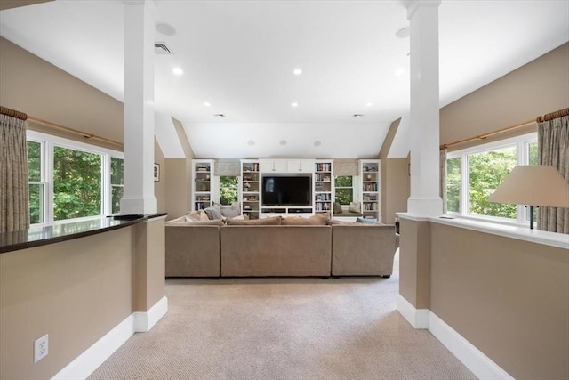 12 Whitcomb Ln, Hingham, MA 02043 - living room with ornate columns, light carpet, lofted ceiling, recessed lighting, and built in shelves