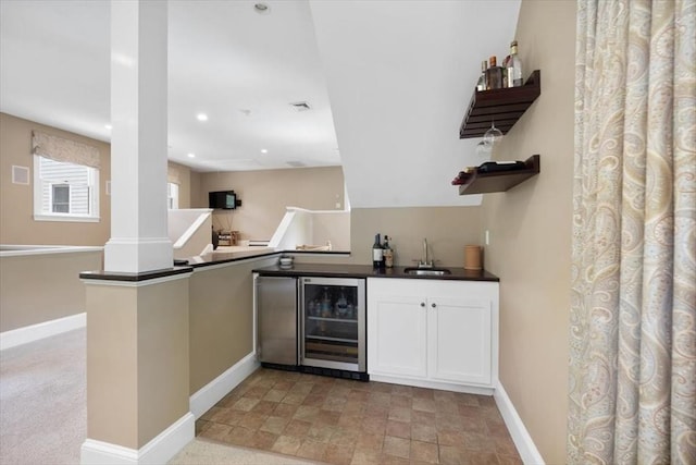 12 Whitcomb Ln, Hingham, MA 02043 - indoor wet bar featuring ornate columns, wine cooler, and recessed lighting