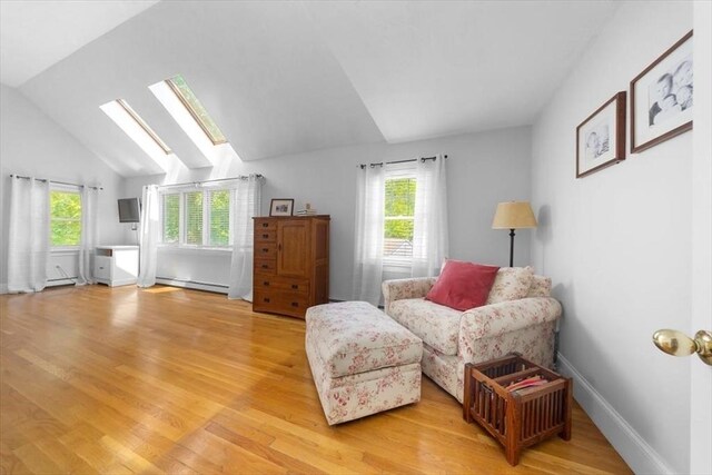 12 Whitcomb Ln, Hingham, MA 02043 - sitting room with a baseboard radiator, plenty of natural light, light wood-style floors, a skylight, and lofted ceiling