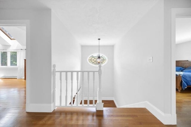 12 Whitcomb Ln, Hingham, MA 02043 - hall featuring an upstairs landing, wood finished floors, and baseboard heating