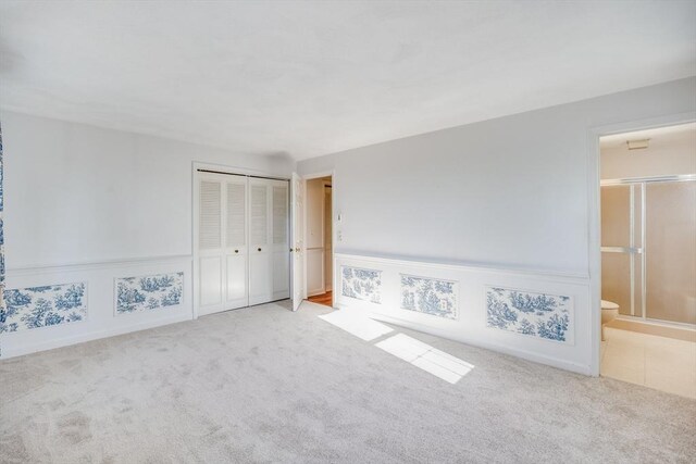 33 Highview Dr Unit 33, Sandwich, MA 02563 - unfurnished bedroom featuring connected bathroom, carpet, and a closet