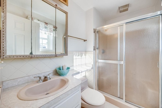 33 Highview Dr Unit 33, Sandwich, MA 02563 - bathroom featuring vanity, toilet, backsplash, and a stall shower